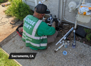 Loose Dirt Irrigation Technician during a sprinkler valve repair - Sacramento, CA