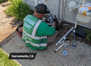 Loose Dirt Irrigation Technician during a sprinkler valve repair - Sacramento, CA